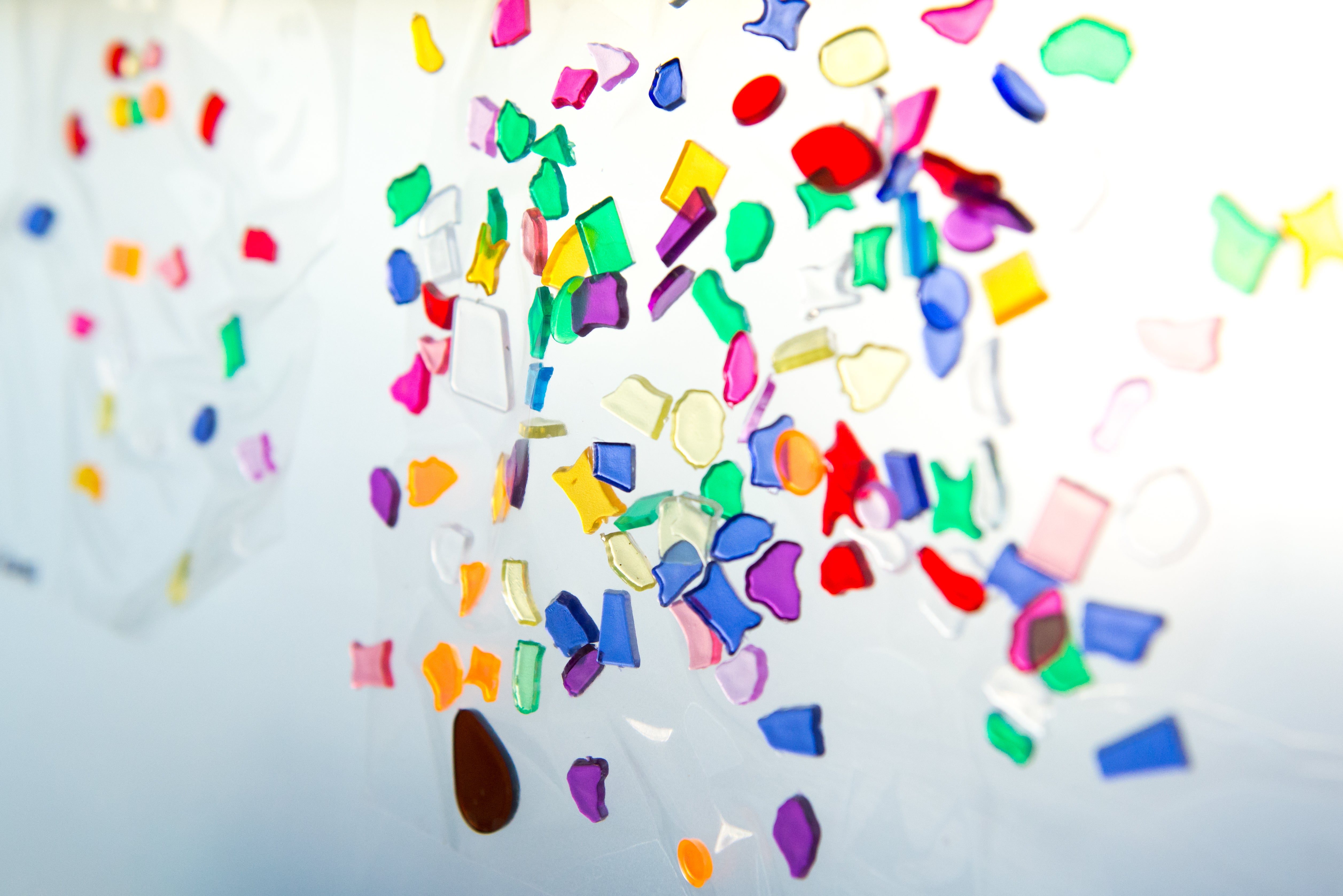 Dozens of colorful shapes on a white background 